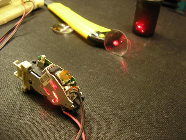Burning a plastic box with an external lens (red laser).