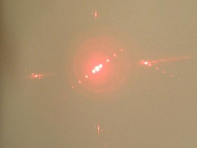 Red laser. In addition to the main beam are seen the side beams.